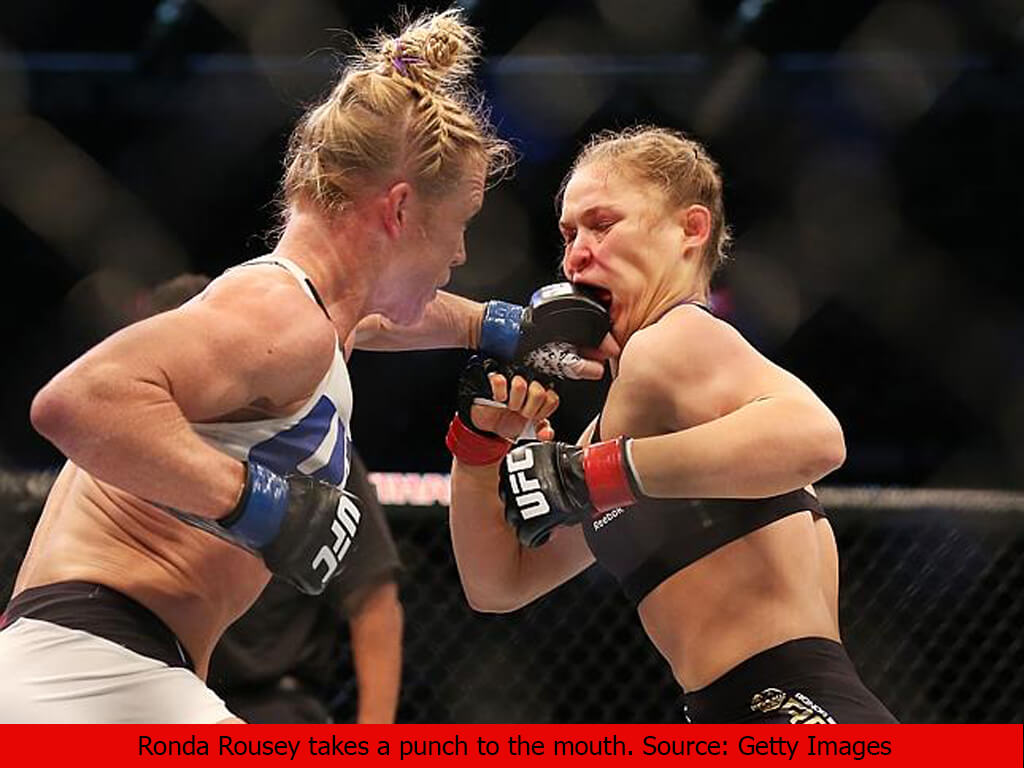 Ronda Rousey takes a punch to the mouth