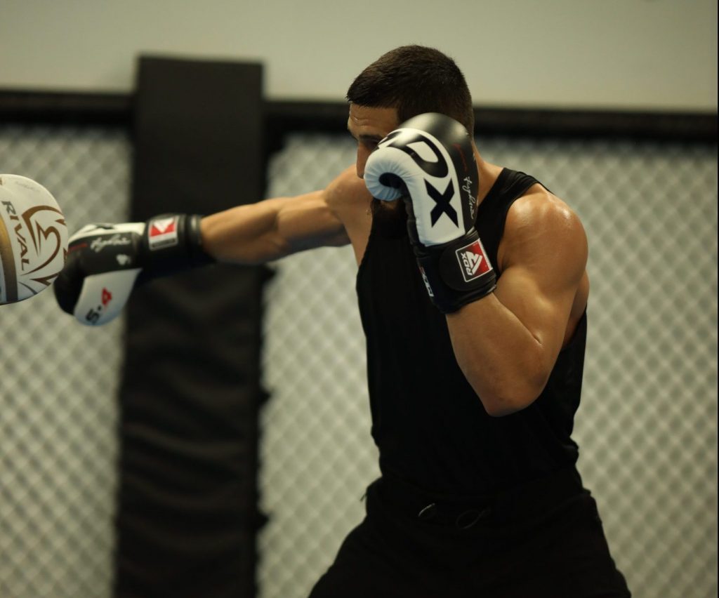 Khamzat throwing Jab while sparring with coach