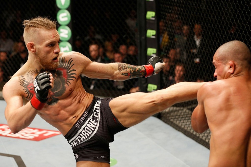 Conor McGregor kicking opponent at MMA fight
