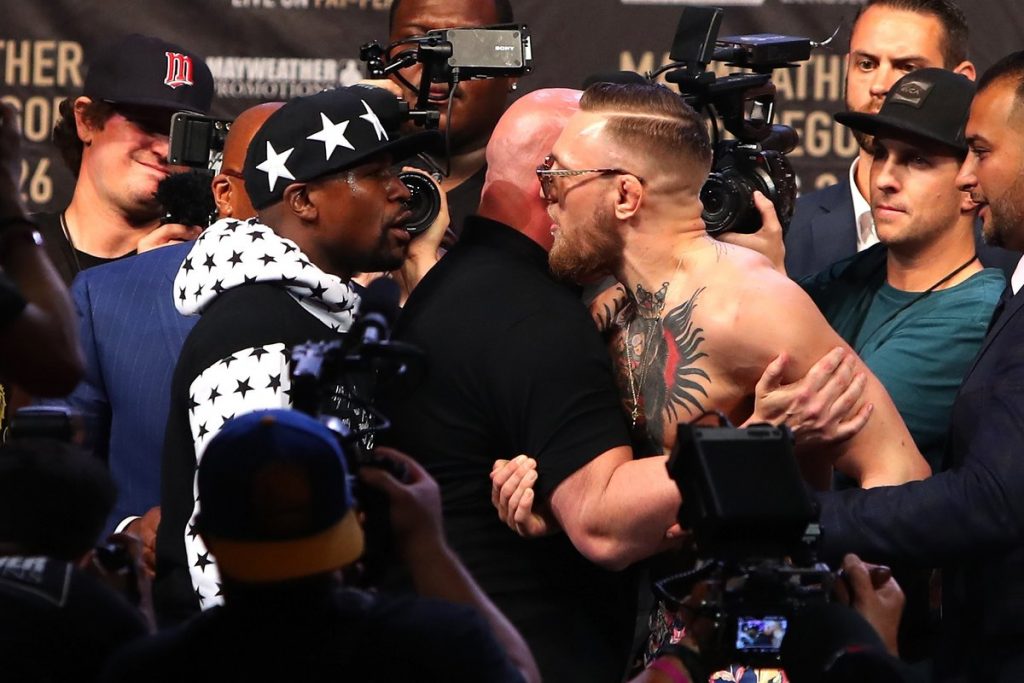 Floyd Mayweather and Conor McGregor scuffle at a presser