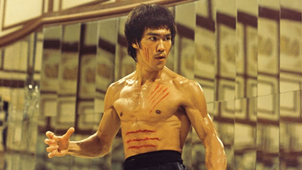 Bruce Lee in fighting stance in film
