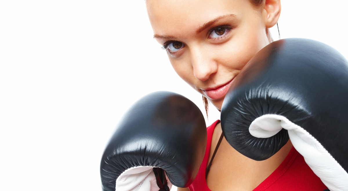 Woman with black and white boxing gloves