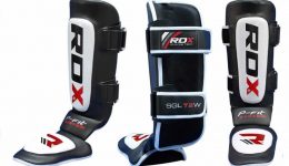Black white and red RDX shin pads fitness gear