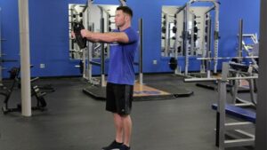 Executing the Plate Front Raise